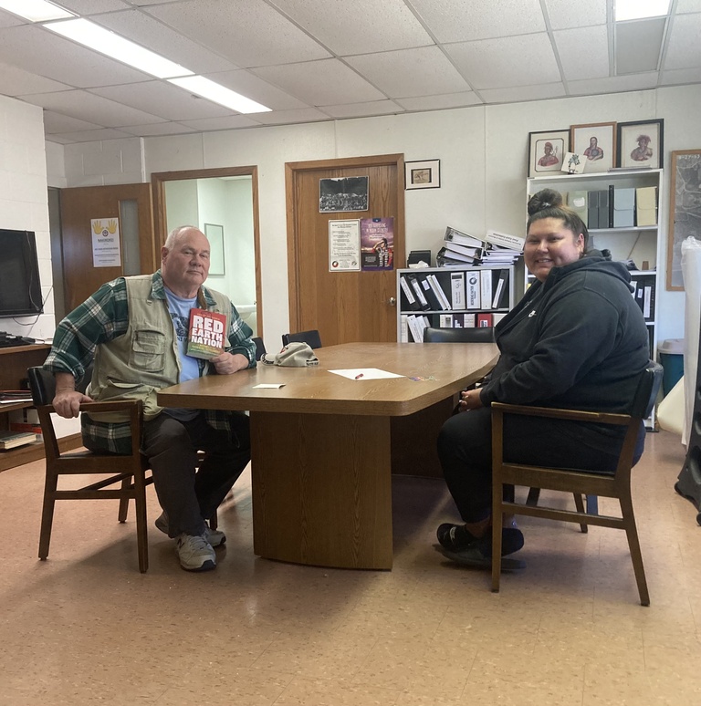 A man and a woman sit at a table