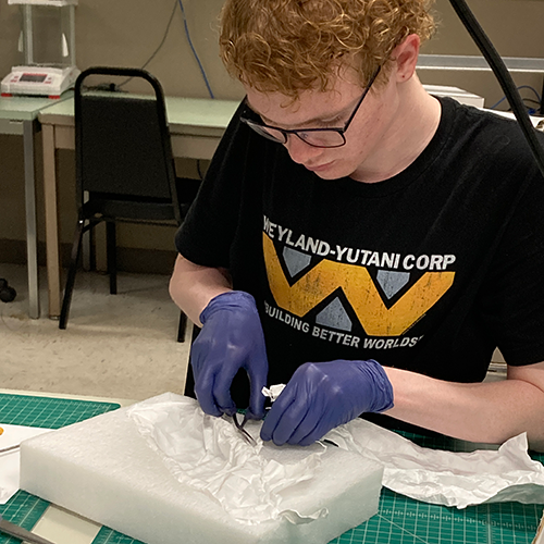 A man prepares a curation box