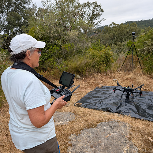 A woman getting ready to launch a drone