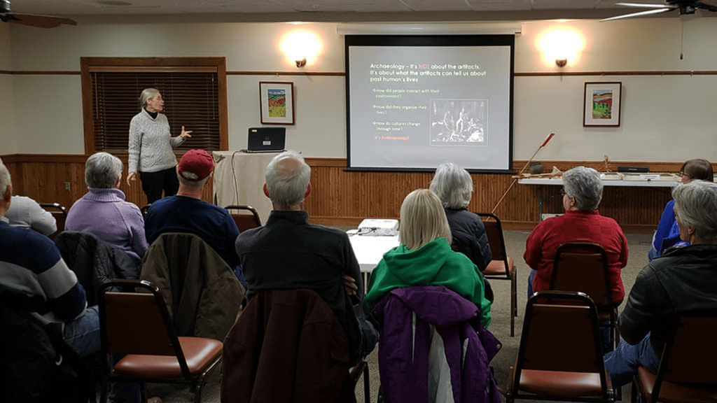 A women giving a slide show presentation