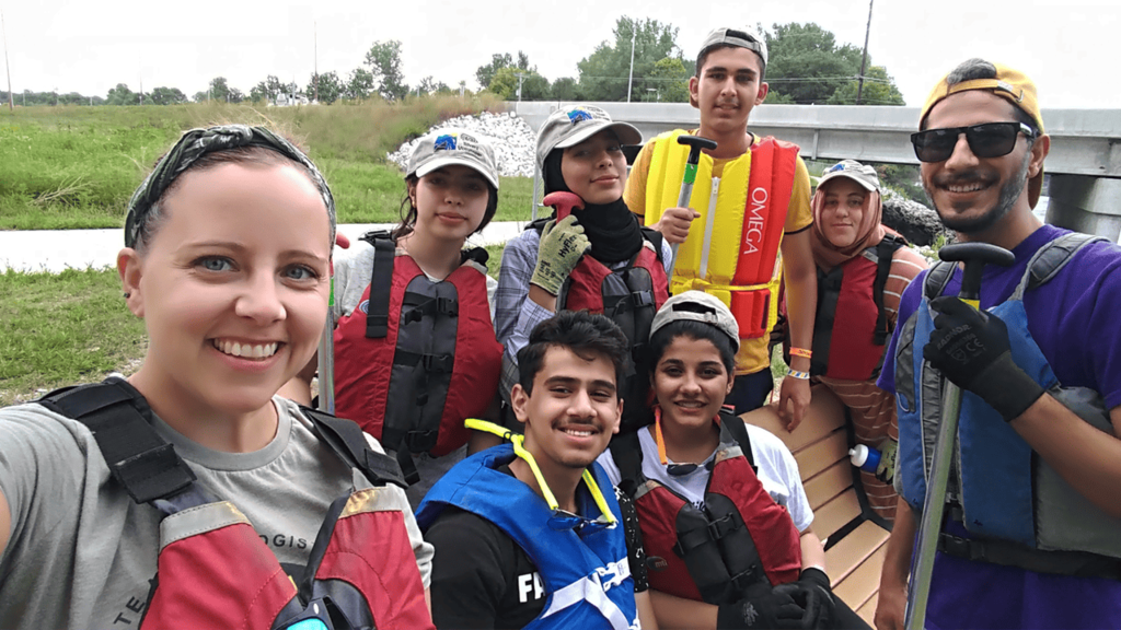 Elizabeth Reetz with international university students, all wearing life jackets