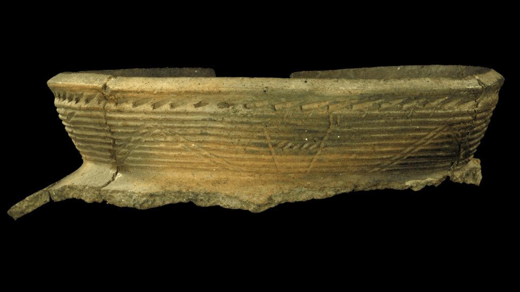 The rim of an ancient pottery vessel
