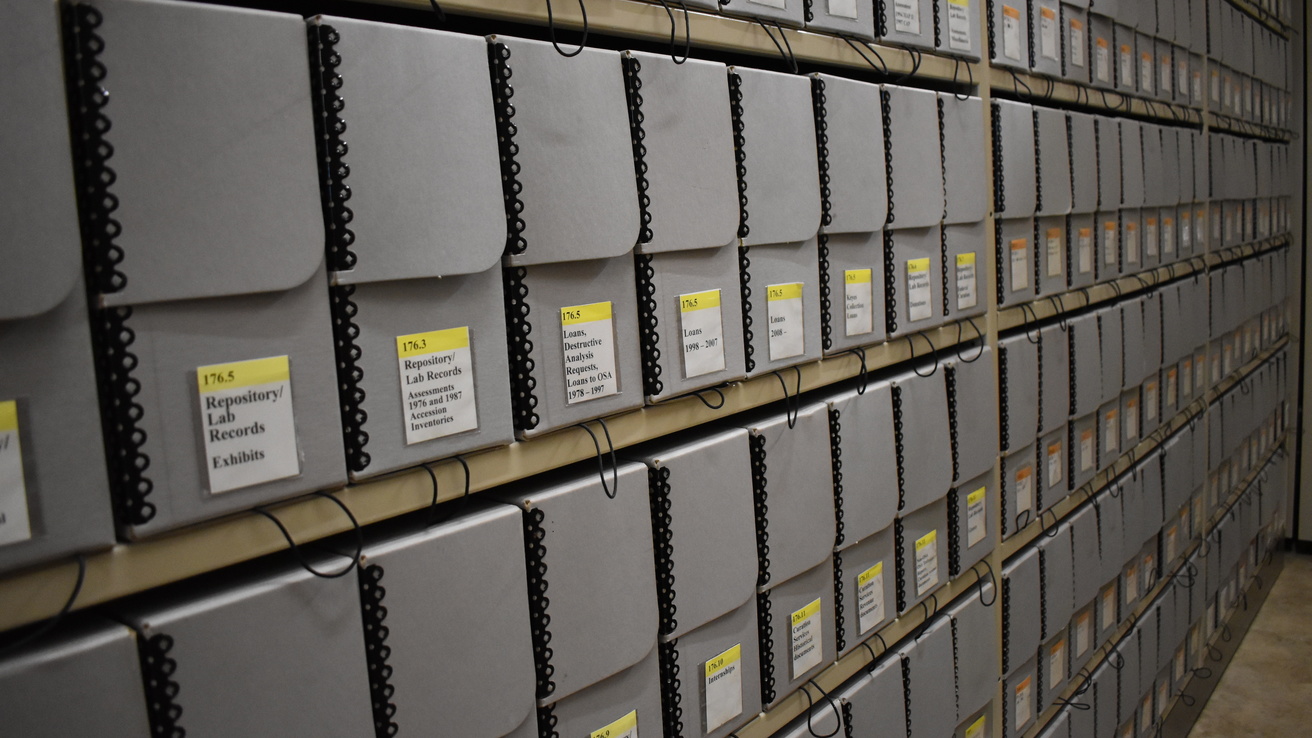 archival document boxes on a shelf